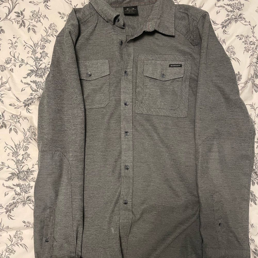 Oakley long sleeve button down. Medium, but fits like a Large. Great condition